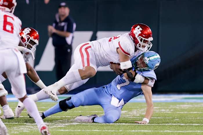 Oct 7, 2021; New Orleans, Louisiana, USA; Houston Cougars defensive lineman Logan Hall (92) sacks Tulane Green Wave quarterback Michael Pratt (7) during the second half at Yulman Stadium. Mandatory Credit: Stephen Lew-USA TODAY Sports